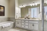 Beach Master Bath has dual sinks, a large 6ft tub and glass enclosed shower
